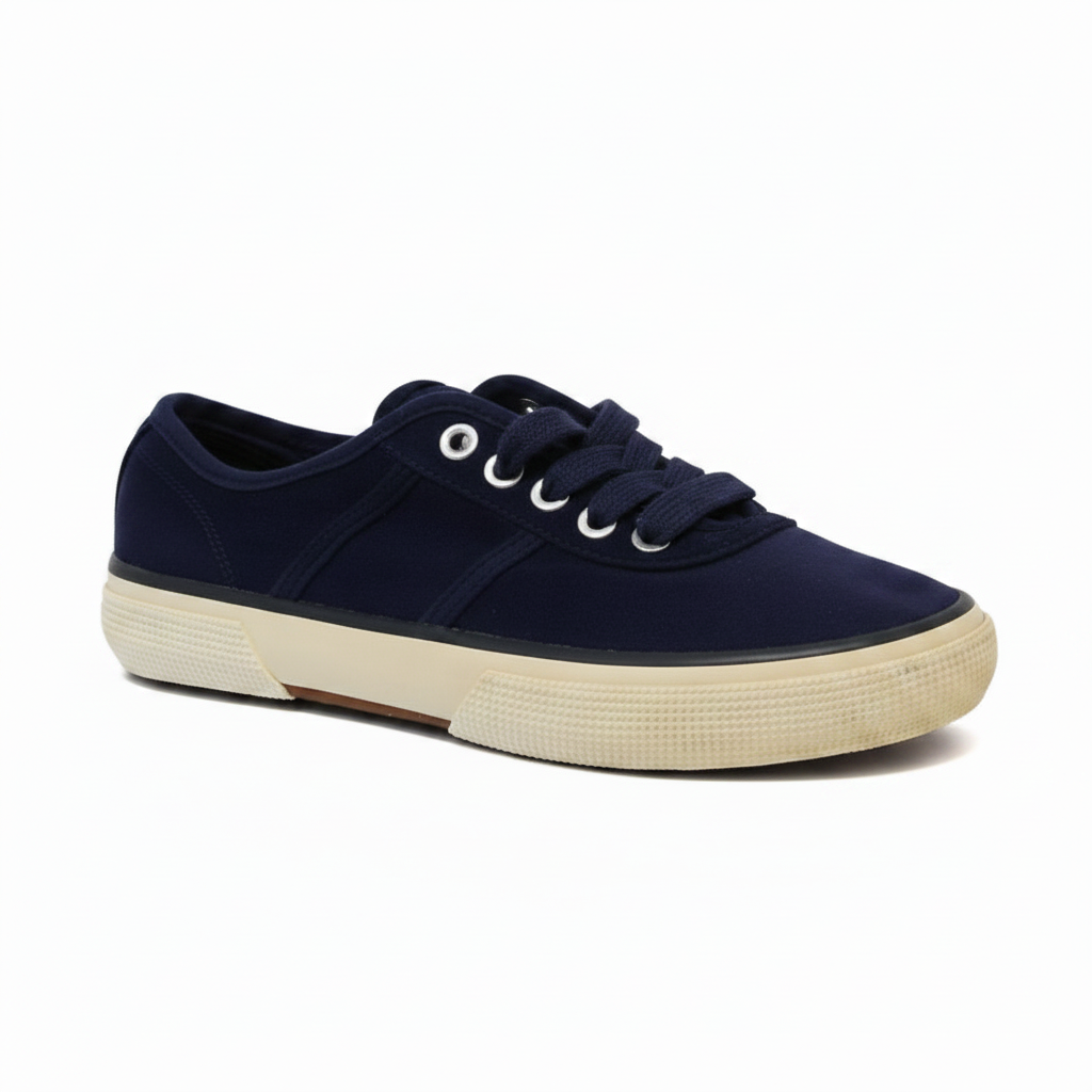 Navy blue sneaker with white laces on a white background