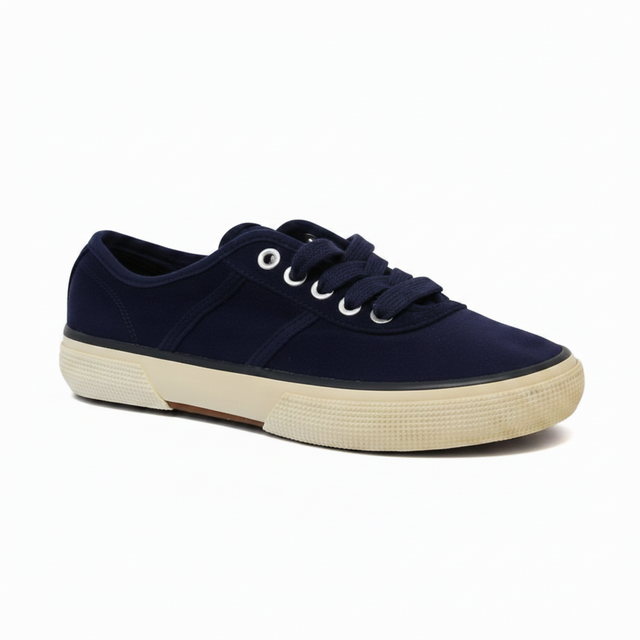 Navy blue sneaker with white laces on a white background